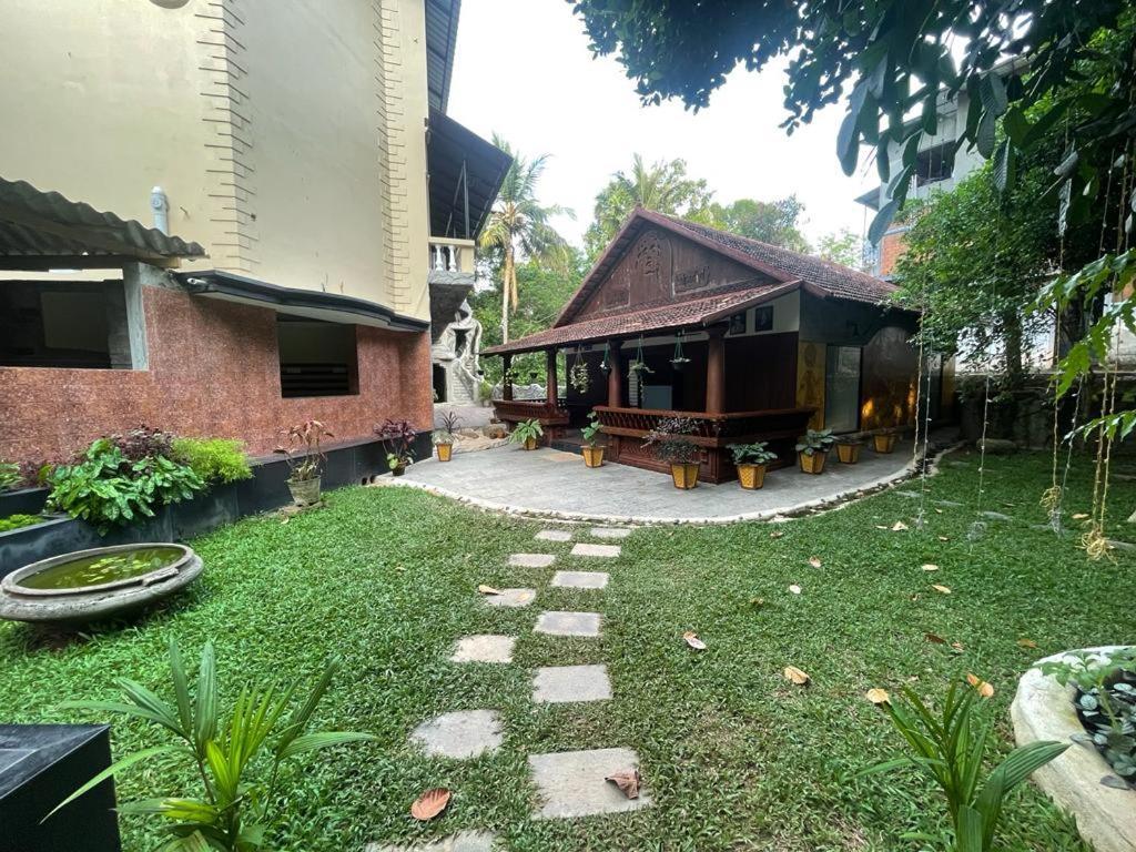 Kalpadiyil Hotel Balarampuram Bagian luar foto